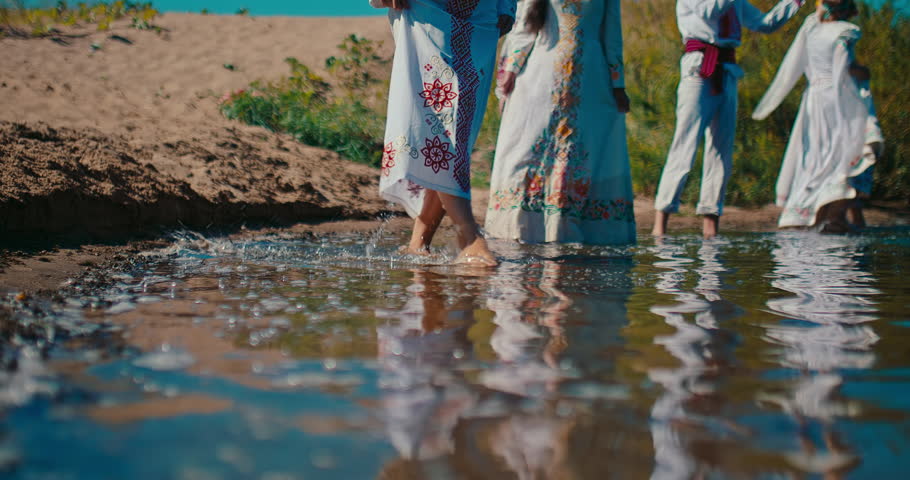 East Slavic celebration of summer solstice, closeup view of legs in river water, 4K, Prores
