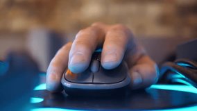 Close-up of a man's hand using a computer mouse while working on a laptop in the evening. A male freelancer clicks a black mouse while browsing the Internet or working on a computer remotely from his - Powered by Shutterstock - Get 15% off with code: PIKWIZARD15