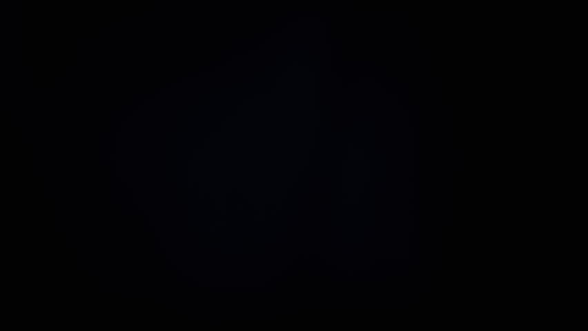 Colorful Soap Bubbles Fly in an Empty Space on Isolated Black Background. Many rainbow transparent bubbles randomly rotate, float, fall. Blurred motion. Selective focus. Abstract. Game. Slow motion.