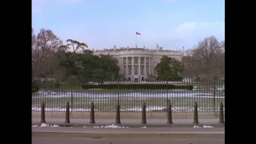 Washington dc - 1995 - a car drives past the white house in washington dc.