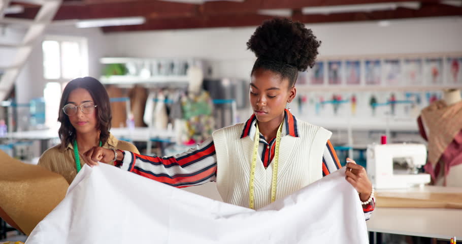 Fashion, teamwork and women with fabric pattern for creative small business design mentorship. Drawing, tailor and designer in collaboration with planing, help and manufacturing clothes together.