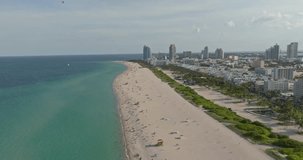Drone view of Miami Beach, South Beach, Florida. Cinematic video of a luxury resort in Miami South Beach. Miami Beach on a sunny day, aerial view. Downtown Miami.