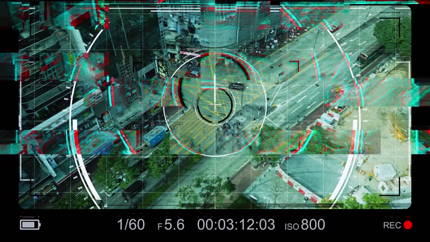 Military display of spy drone pilot flying over Hong Kong city. Topic of surveillance in megacities of China and Asia on busy street. Interference on display of a modern unmanned aerial vehicle. Royalty-Free Stock Footage #3438222697