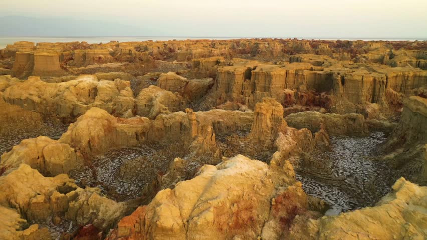 Aerial, Dallol, Geothermal, Rocks, Danakil, Aerial Footage, Geological Formation, Volcanic Landscape, Natural Wonders, Drone Shots, Aerial View, Ethiopian Landscapes, Geothermal Activity, Salt Plains, Royalty-Free Stock Footage #3438225387