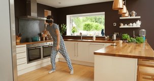 Virtual reality, man and dance in kitchen, digital world for singing with energy and fun, future technology and metaverse. Karaoke, VR headset and music at home with video game and 3D software
