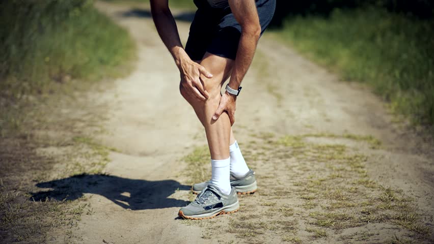 Knee Discomfort Muscle Sprain Strain.Runner Legs Trauma And Muscular Pain Cramp.Joint Fatigue Exertion Pain On Knee.Muscle Cramp Sore Pain. Running Overexertion Muscle Cramp Exhaustion Ache Spasm Pain