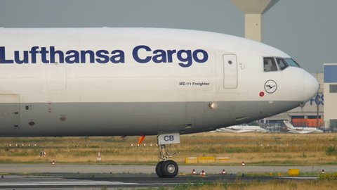 FRANKFURT AM MAIN, GERMANY - JULY 19, 2017: Lufthansa cargo MD-11 D-ALCB taxiing, slow motion. Fraport, Frankfurt Germany