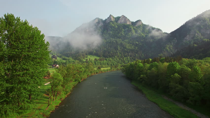 Aerial view of Trzy Korony mountain in Pieniny in summer, Poland. Landscape of the beautiful peak Three Crowns with morning fog and mountain river on the Slovakia - Poland border
