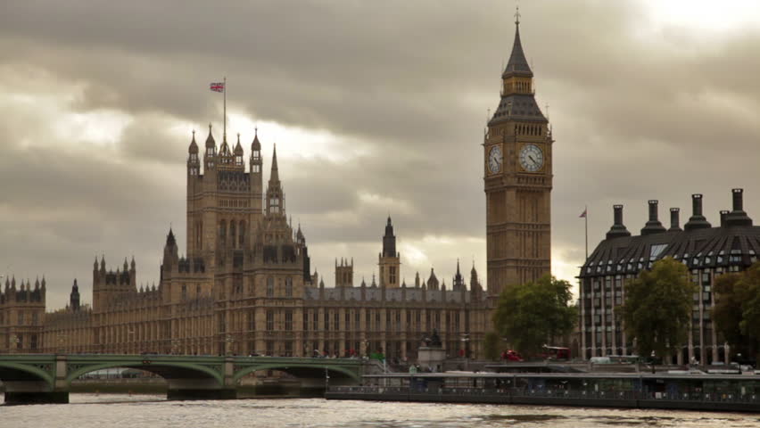 Big ben and Westminster palace, birds fly over water in foreground, located in