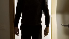 A dark room,a door opens with a silhouette of an unrecognisable man appears, he stands in the doorway and looks at his victim.Focus on shadow. - Powered by Shutterstock - Get 15% off with code: PIKWIZARD15