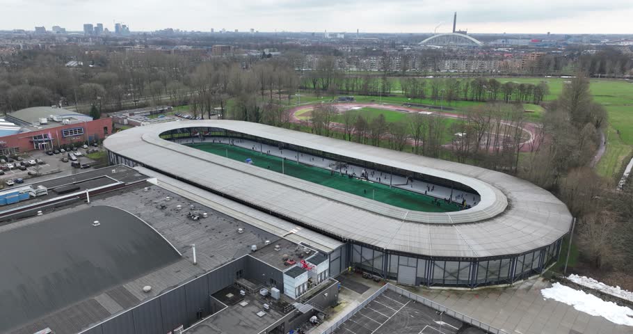 Top down birds eye view on partly covered 400 meter outdoor rink for long track speed skating and an indoor hall for ice hockey and figure skating. Utrecht, The Netherlands.