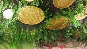 Woven bamboo baskets on a wall with green ferns creating a natural and rustic decorative interior background design asia india - Powered by Shutterstock - Get 15% off with code: PIKWIZARD15