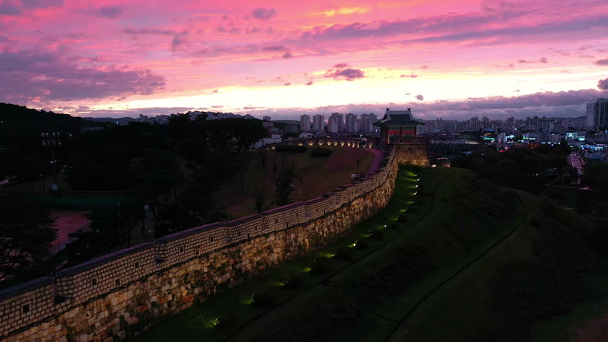 Drone view, Hwaseong Fortress during dusk and sunset sky, South Korea