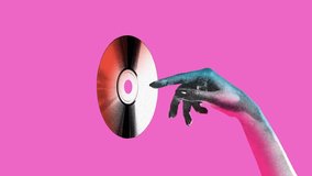 Stop motion. Modern creative animation. Female hand holding vintage disk for recording in old paper style isolated pink background. Concept of youth culture, retro, technology. Horizontal orientation