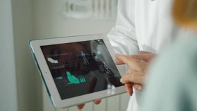 In a clinic or hospital, a doctor talks to his elderly patient and explains how the tests went via the tablet.
Technology and medicine concept - Powered by Shutterstock - Get 15% off with code: PIKWIZARD15