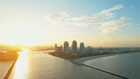 Miami aerial drone view. Art deco district. Famous avenue. Drone view, sunset sky, sand beach. Ocean Drive in Miami. Twilight beach. Aerial view of Ocean Drive at Miami. Summer in Miami.