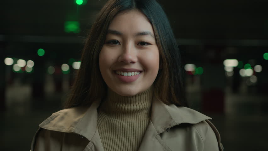 Asian pretty young woman beautiful ethnic chinese korean girl happy joyful business lady smiling businesswoman japanese female car owner in dark parking looking at camera with dental smile wellness Royalty-Free Stock Footage #3438777957
