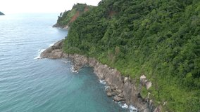 aerial drone view of the tropical beach, coastal with waves, trees, stones
