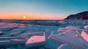 Frozen winter lake Baikal Siberia Russia. Ice blocks and hummocks in the snow. Natural cold ice background. Winter abstract background. High quality 4k footage - Powered by Shutterstock - Get 15% off with code: PIKWIZARD15