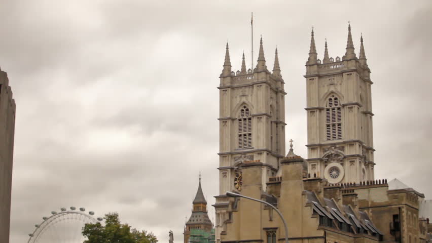 The front towers of Westminster Abbey with the London Eye in the background.