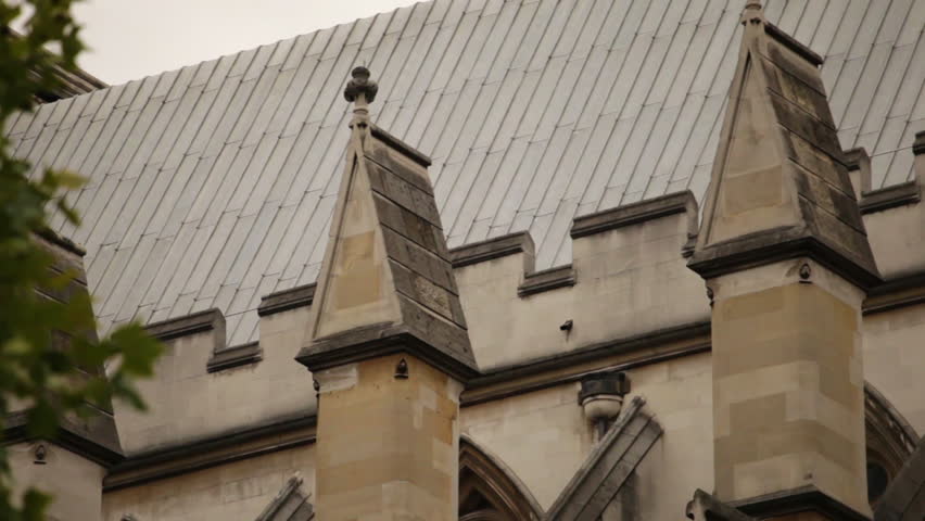 Zoom out from the flying buttresses of Westminster Abbey in London.