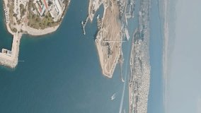Vertical video. Athens, Greece. City and port panorama. View of the port of Piraeus, Aerial View