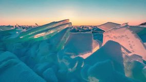 Frozen winter lake Baikal Siberia Russia. Ice blocks and hummocks in the snow. Natural cold ice background. Winter abstract background. High quality 4k footage - Powered by Shutterstock - Get 15% off with code: PIKWIZARD15