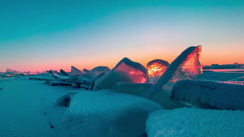 Frozen winter lake Baikal Siberia Russia. Ice blocks and hummocks in the snow. Natural cold ice background. Winter abstract background. High quality 4k footage