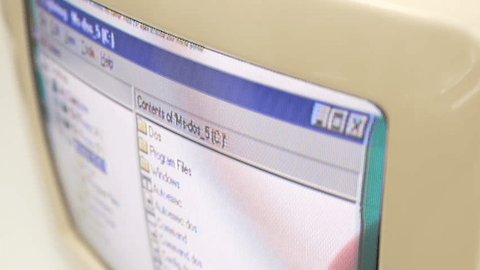 FEBRUARY 15, 2024: In closeup, someone is using a vintage Windows PC computer screen, capturing the classic user interface and design reminiscent of earlier computing experiences. – Video báo chí có sẵn
