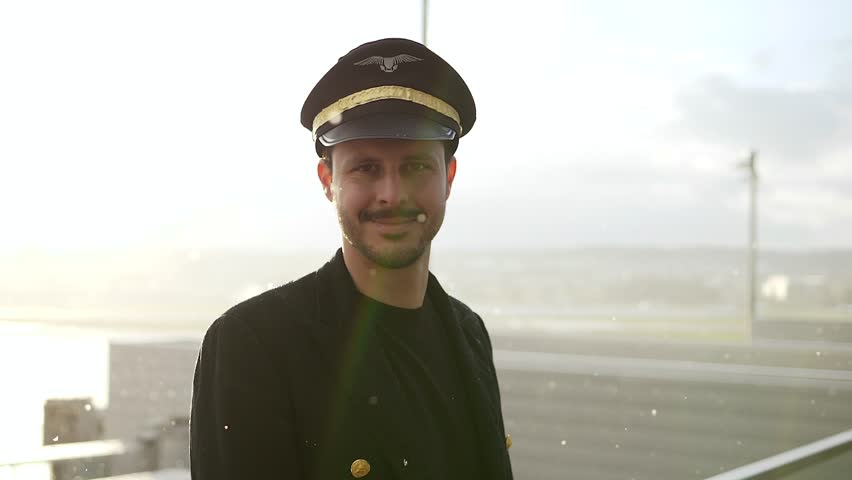 Portrait of Proffesional Male Pilot Captain Working in Aviation Business