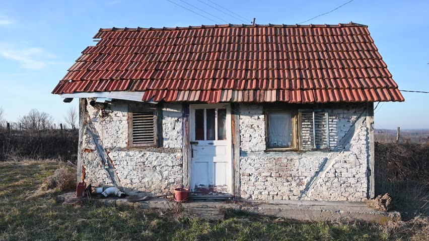 Old house in the village. Cute little house in countryside. Traditional construction. 