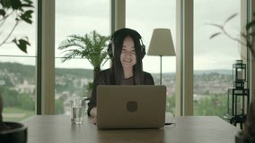 Young Asian Woman Using Laptop Computer Inside Apartment Home