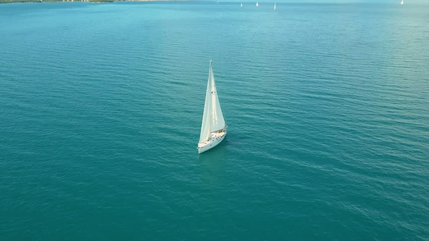 Yacht sailing on opened sea. Sailing boat. Yacht from drone. Yachting video. Yacht from above. Sailboat from drone. Sailing video. Yachting at windy day. Yacht. Sailboat. Royalty-Free Stock Footage #34396435