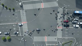 Vertical video. Top view of morning traffic at intersection in Ho Chi Minh City, Vietnam.