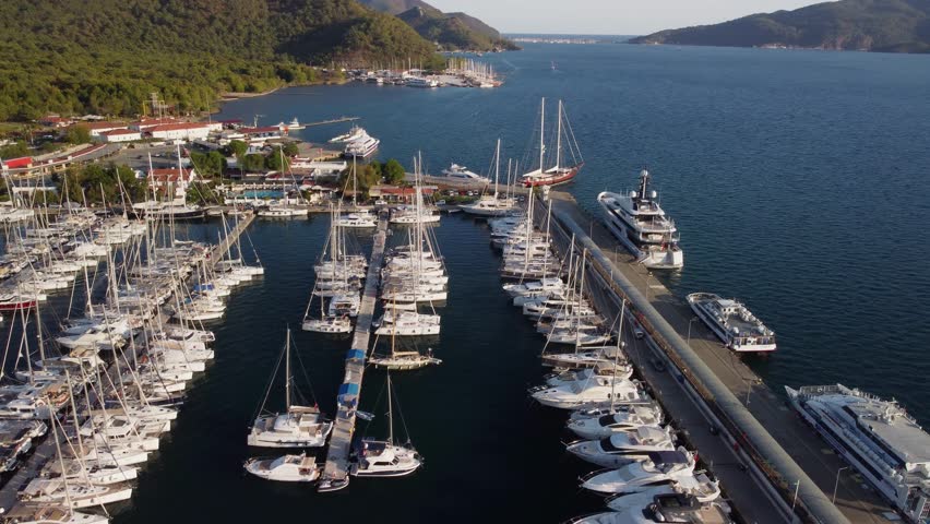 Awesome aerial view of Marmaris Marina in Turkey. Drone flying over the sea. The port city is a popular tourist destination in the Turkish Riviera.
