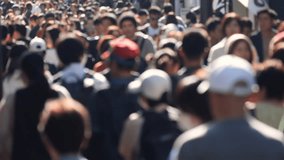 Unfocused blurry crowd of people walking in the street. Slow motion. - Powered by Shutterstock - Get 15% off with code: PIKWIZARD15