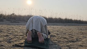 A Pakistani VillagerMan Salah ( Salat ) Namaz Pray on the bank of the river 4k video clip