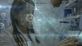 Animation of network of connections over caucasian female doctor using tablet. Global medicine, technology and digital interface concept, digitally generated video.