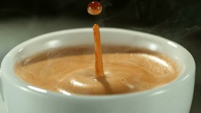 Super slow motion of falling drop into coffee with camera motion. Filmed on high speed cinema camera, 1000fps placed on high speed cine bot. - Powered by Shutterstock - Get 15% off with code: PIKWIZARD15