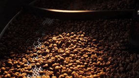 Coffee roaster machine mixing aroma beans. Preparation fresh aroma caffeine on manufacturing warehouse. Close-up Make ready coffee in large roaster falling beans. Production of fresh fried coffee - Powered by Shutterstock - Get 15% off with code: PIKWIZARD15