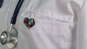 World Autism Awareness and Pride Day with ribbon with puzzle pattern - Powered by Shutterstock - Get 15% off with code: PIKWIZARD15