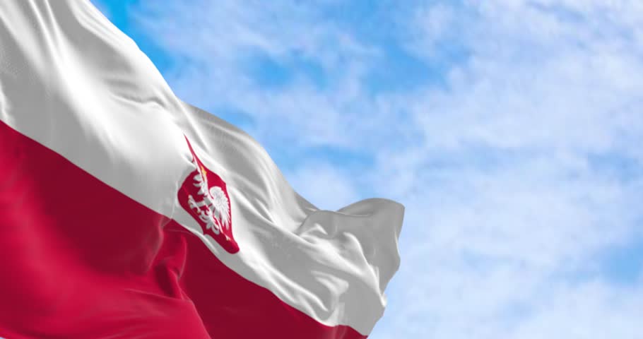 Close-up of Poland national flag waving in the wind on a clear day. Two horizontal white and red stripes with coat of arms. Seamless 3d render animation. Slow motion loop. Selective focus