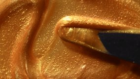 Golden smear of liquid gold paint texture background mixing by palette knife. Painting Gold metallic paint close-up. Liquid gold Art design backdrop. Leaking Lipgloss, nail polish, make-up backdrop  - Powered by Shutterstock - Get 15% off with code: PIKWIZARD15
