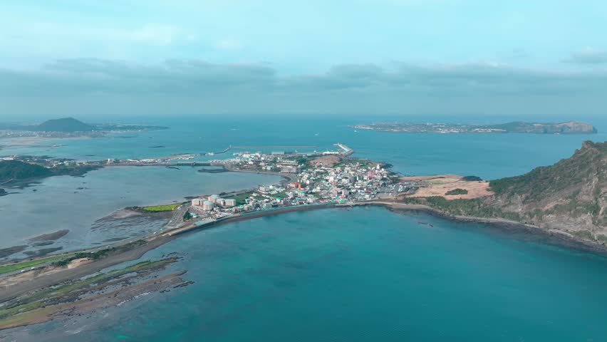 Drone View of Jeju island in South Korea, Sunrise Peak in Seongsan, Yunasco, winter