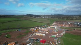 Paignton, South Devon, England: DRONE VIEWS: The drone circles a new build housing development under construction on green belt land at White Rock. Paignton is a popular UK holiday resort (Clip 10).