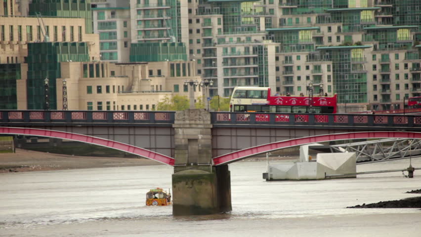 A shot of Lambeth Bridge with cars and buses going across it in London, England