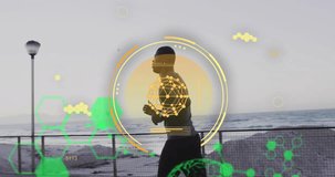 Animation of scanner, elements and data over african american man running by sea. Data, digital interface, processing, fitness, health and communication, digitally generated video.