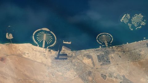 Artificial Islands of the Coast of Dubai, World Islands, Palm Jumeirah and Palm Jebel Ali, in  United Arab Emirates, Seen from Space. Elements of this Video furnished by NASA. 