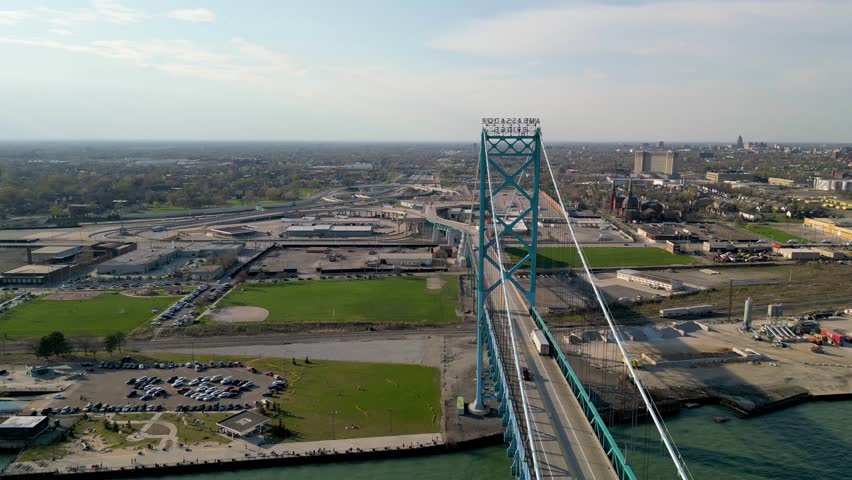Detroit, Michigan USA - April 15, 2023: The Ambassador Bridge remains the largest international suspension bridge in North America. Royalty-Free Stock Footage #3440276481