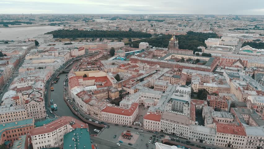 SAINT-PETERSBURG, RUSSIA - JUNE, 2023: Aerial sideways Petersburg central historical cityscape overall plan. Winter palace square Hermitage, Admiralty, St. Isaac's Cathedral. Neva river ships sail.